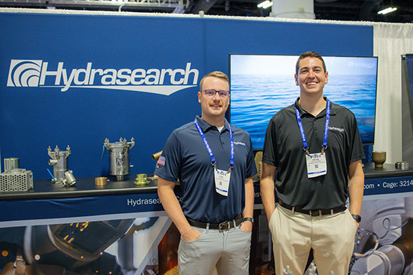 Two Hydrasearch team members at a tradeshow