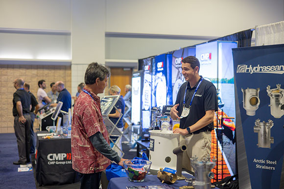 Hydrasearch employees working at a tradeshow
